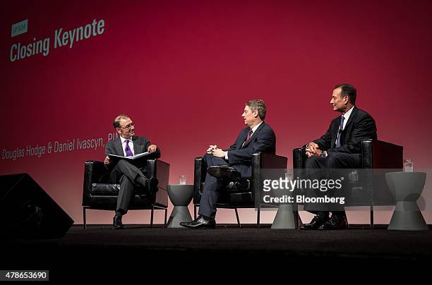 Jon Hale, director of manager research for Morningstar Inc., left, moderates a panel discussion with Daniel Ivascyn, chief investment officer of...