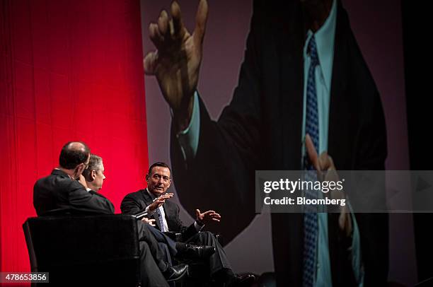 Douglas Hodge, chief investment officer of Pacific Investment Management Co. , right, speaks during a panel discussion with Daniel Ivascyn, chief...