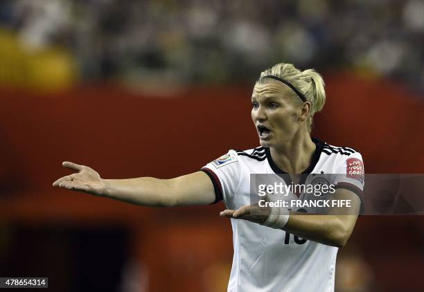 Germany's midfielder Dzsenifer Marozsan reacts during the quarter-final football match between Germany and France in the 2015 FIFA Women's World Cup...