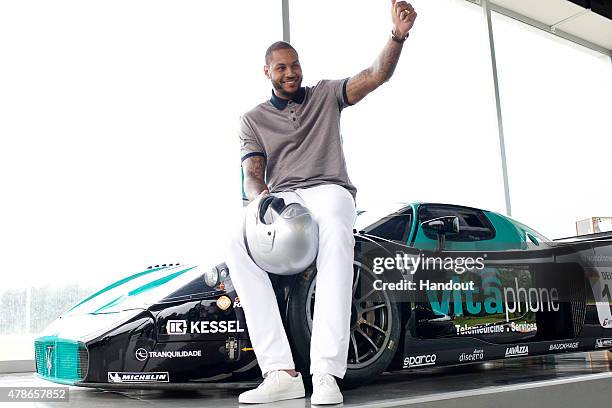 In this handout photo provided by Maserati, Carmelo Anthony with the Maserati MC12 June 16, 2015 at Balocco Circuit, Italy. New York Knicks...