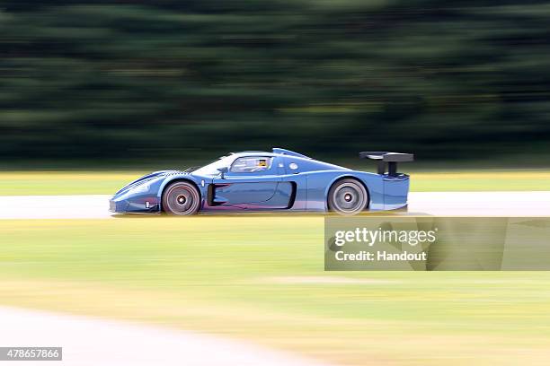 In this handout photo provided by Maserati, Maserati MC12 June 10, 2015 at Balocco Circuit, Italy. New York Knicks basketball player and NBA...