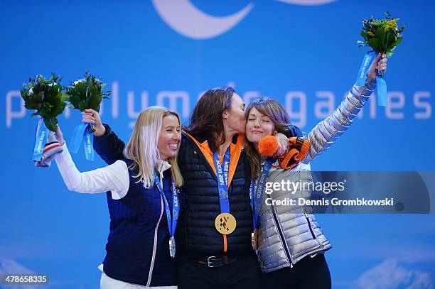 Silver medalist Cecile Hernandez Cervellon of France, gold medalist Bibian Mentel-Spee of Netherlands and bronze medalist Amy Purdy of the United...