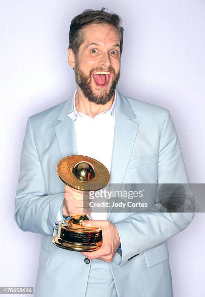 Writer Producer poses with his award for Best Network Television Series for 'Hannibal' at 41st Annual Saturn Awards held at The Castaway on June 25,...