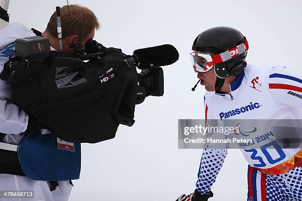 Valerii Redkozubov of Russia looks into a TV camera in the Men's Super Combined Visually Impaired Super G during day seven of the Sochi 2014...