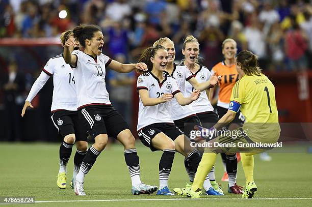 Nadine Angerer of Germany celebrates with team mates as she saves the final penalty during the FIFA Women's World Cup Canada 2015 Quarter Final match...