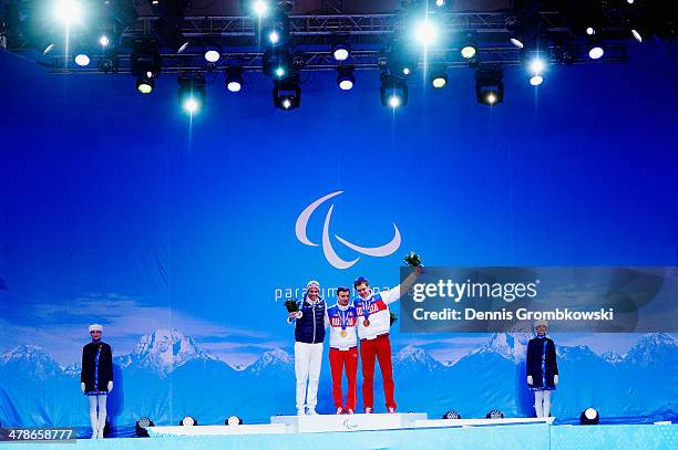 Silver medalist Vincent Gauthier-Manuel of France, gold medalist Alexey Bugaev of Russia and bronze medalist Alexander Alyabyev of Russia celebrate...