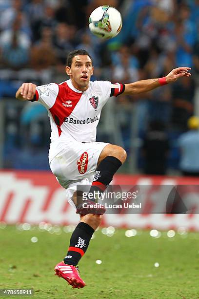 Maxi Rodrigues of Newell's Old Boys runs for the ball during the Copa Bridgestone Libertadores 2014 match between Gremio v Newell's Old Boys at Arena...