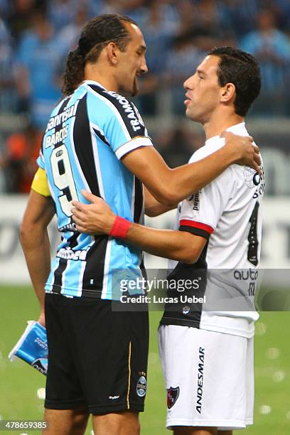 Hernan Barcos of Gremio and Maxi Rodrigues of Newell's Old Boys before the Copa Bridgestone Libertadores 2014 match between Gremio v Newell's Old...