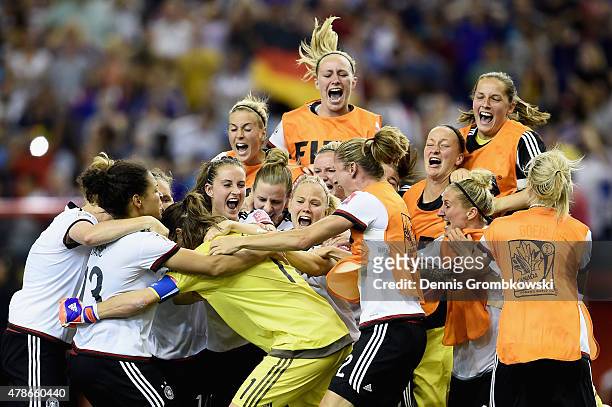 Nadine Angerer of Germany celebrates with team mates as she saves the final penalty during the FIFA Women's World Cup Canada 2015 Quarter Final match...