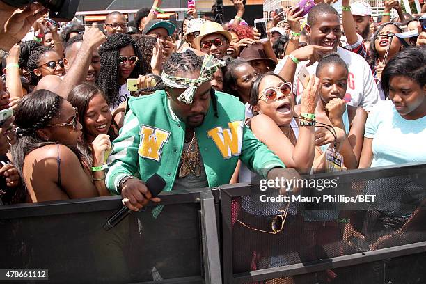 Recording artist Wale performs onstage during 106 & Park with ESPN cross promotion Sports Center during the 2015 BET Experience at Nokia Plaza on...