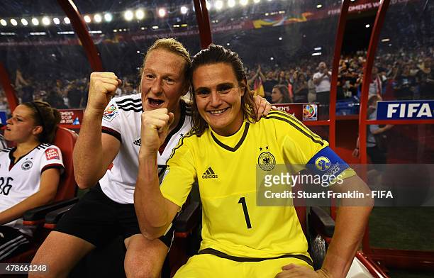 Nadine Angerer of Germany celebrates with Melanie Behringer after the quarter final match of the FIFA Women's World Cup between Germany and France at...