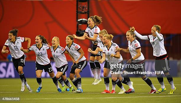 The players of Germany celebrate winning the quarter final match of the FIFA Women's World Cup between Germany and France at Olympic Stadium on June...