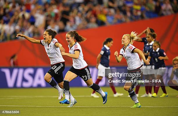 Celia Sasic, Sara Daebritz and Leonie Maier of Germany celebrate winning the quarter final match of the FIFA Women's World Cup between Germany and...