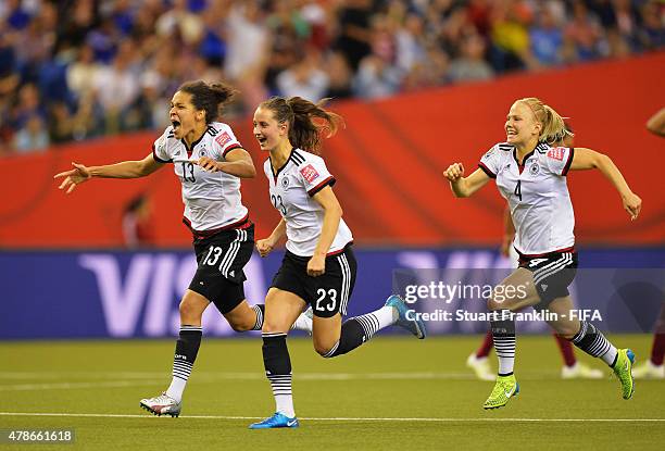 Celia Sasic, Sara Daebritz and Leonie Maier of Germany celebrate winning the quarter final match of the FIFA Women's World Cup between Germany and...