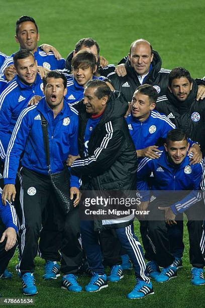 Ramon Diaz coach of Paraguay jokes with players during a training session at Alcaldesa Ester Roa Rebolledo Municipal Stadium on June 26 2015 in...