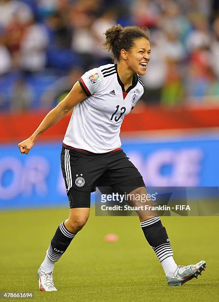 Celia Sasic of Germany celebrate winning the quarter final match of the FIFA Women's World Cup between Germany and France at Olympic Stadium on June...