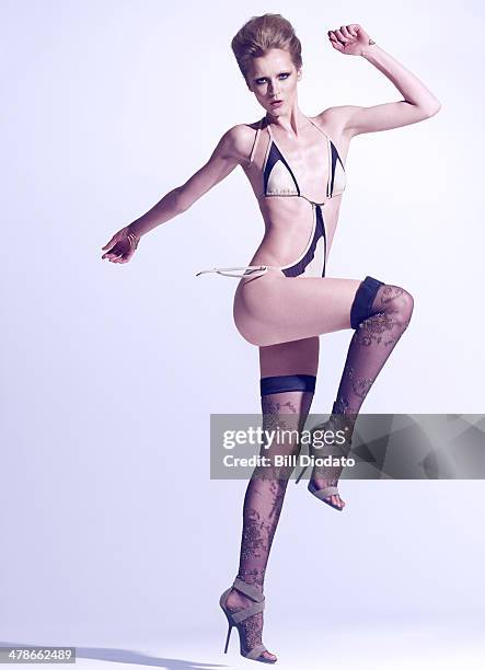 woman in swimsuit, jumping - women wearing black stockings stock-fotos und bilder