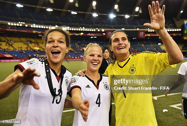 Celia Sasic, Leonie Maier and Nadine Angerer of Germany celebrate winning the quarter final match of the FIFA Women's World Cup between Germany and...