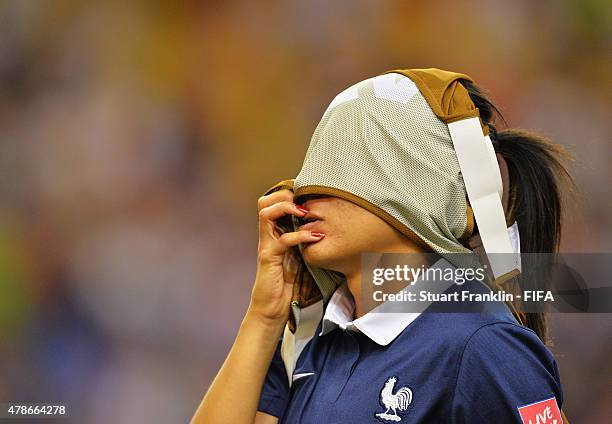 Kenza Dali of France looks dejected after her team lost in a penalty shootout during the quarter final match of the FIFA Women's World Cup between...