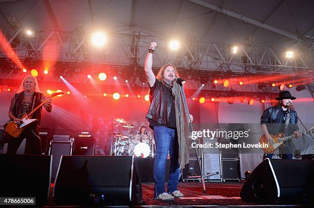 Musicians Rickey Medlocke, Michael Cartellone, Johnny Van Zant, and Gary Rossington of Lynyrd Skynyrd perform onstage during day 1 of the Big Barrel...