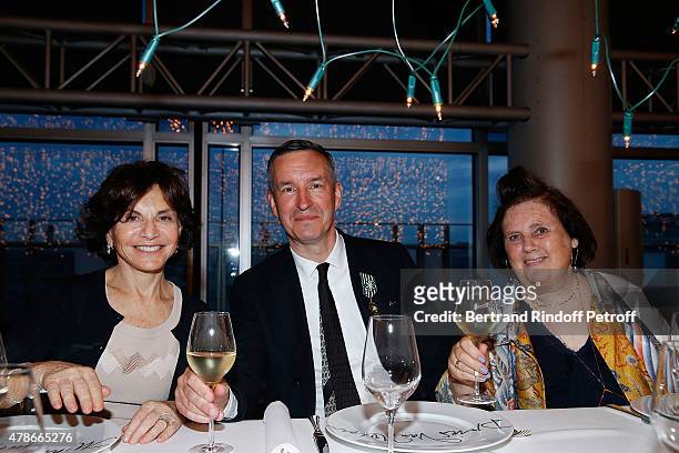 Monique Lang, Designer Dries van Notten and Journalist Suzy Menkes attend the Dinner for Honored Designer Driess Van Notten Officier des Arts et...