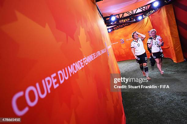 Josephine Henning and Tabea Kemme of Germanywalk in the players tunnel after the quarter final match of the FIFA Women's World Cup between Germany...