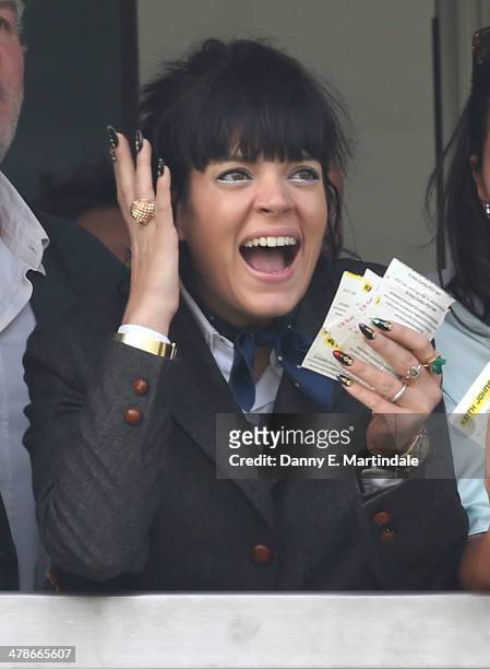 Lily Allen celebrates watching her horse win the Cheltenham Gold Cup Steeple Chase on day 4 of The Cheltenham Festival at Cheltenham Racecourse on...