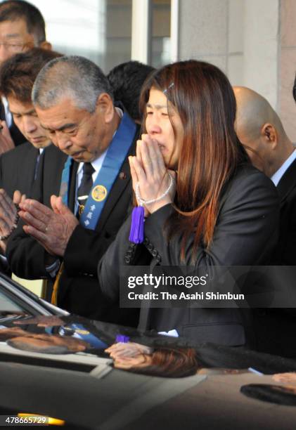 Three-time Olympic gold medalist Saori Yoshida sheds tears at her father Eikatsu's funeral on March 14, 2014 in Tsu, Mie, Japan.