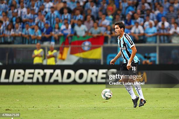 Riveros of Gremio runs for the ball during the Copa Bridgestone Libertadores 2014 match between Gremio v Newell's Old Boys at Arena do Gremio Stadium...