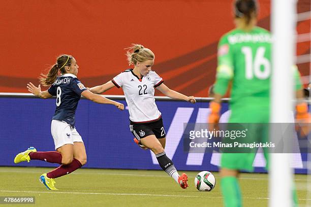 Tabea Kemme of Germany tries to move the ball past Jessica Houara of France during the 2015 FIFA Women's World Cup quarter final match at Olympic...