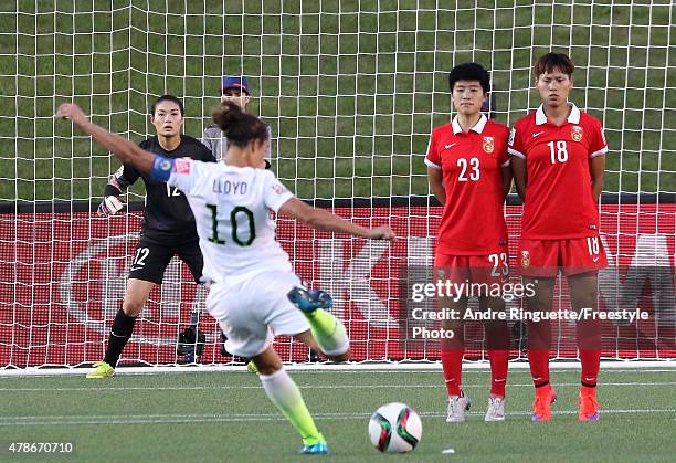 Goalkeeper Wang Fei of China looks on as Carli Lloyd of the United States takes a free kick in the first half as Ren Guixin and Han Peng of China...