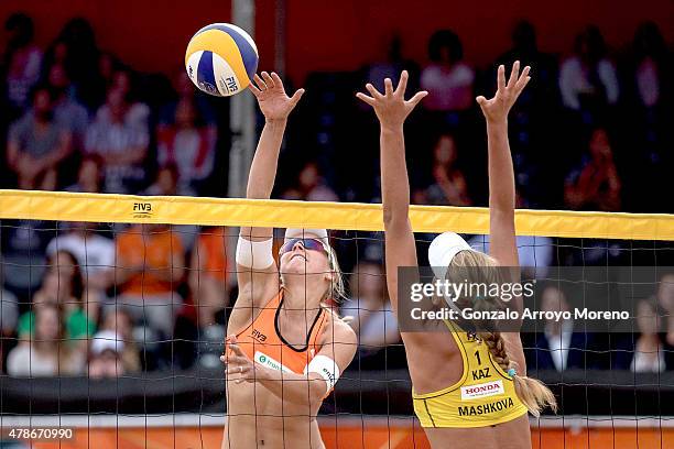 Marleen Van Iersel of the Netherlands attacks Tatyana Mashkova of Kazakhstan during the FIVB Beach Volleyball World Championships female match...