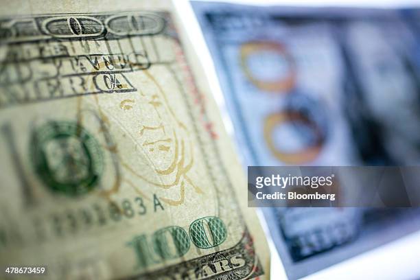 Watermark simulation is seen on a counterfeit $100 bill in the counterfeit specimen vault room at the U.S. Secret Service in Washington, D.C., U.S.,...