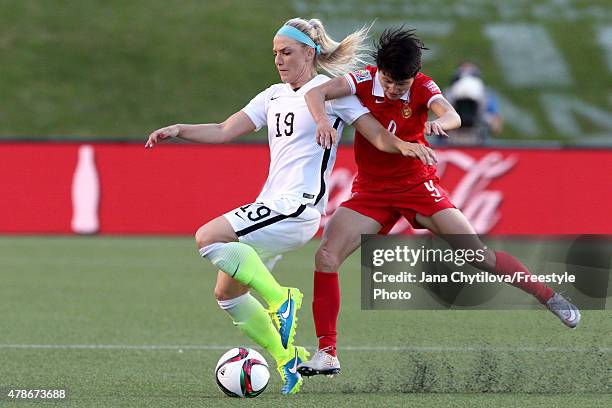 Julie Johnston of the United States competes for the ball in the first half with Wang Shanshan of China in the FIFA Women's World Cup 2015 Quarter...