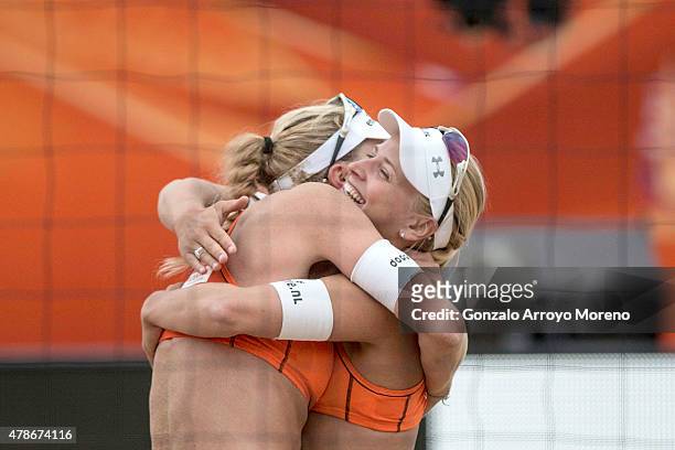 Marleen Van Iersel of the Netherlands embraces her teammate Marleen Van Iersel after winning the FIVB Beach Volleyball World Championships female...