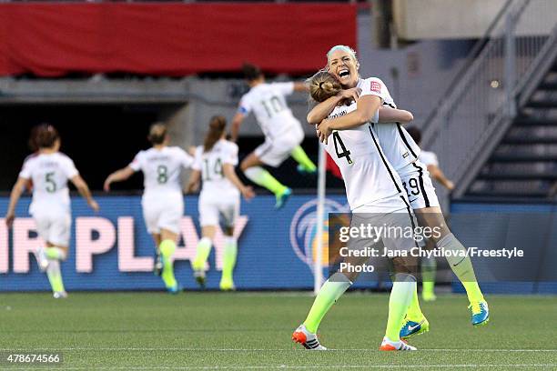 Becky Sauerbrunn and Julie Johnston of the United States celebrate after a goal by Carli Lloyd in the second half against China in the FIFA Women's...