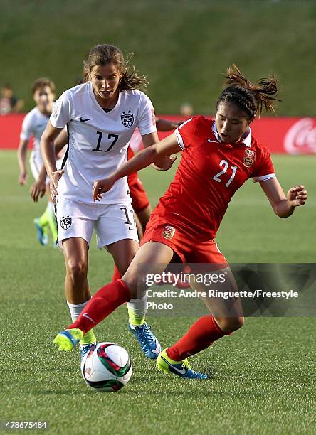 Tobin Heath of the United States challenges Wang Lisi of China in the second half in the FIFA Women's World Cup 2015 Quarter Final match at Lansdowne...