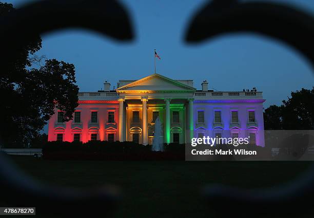 Rainbow-colored lights shine on the White House to celebrate today's US Supreme Court ruling in favor of same-sex marriage June 26, 2015 in...
