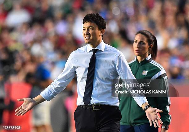 China's coach Hao Wei gestures during a 2015 FIFA Women's World Cup quarterfinal match between the US and China at Lansdowne Stadium in Ottawa,...