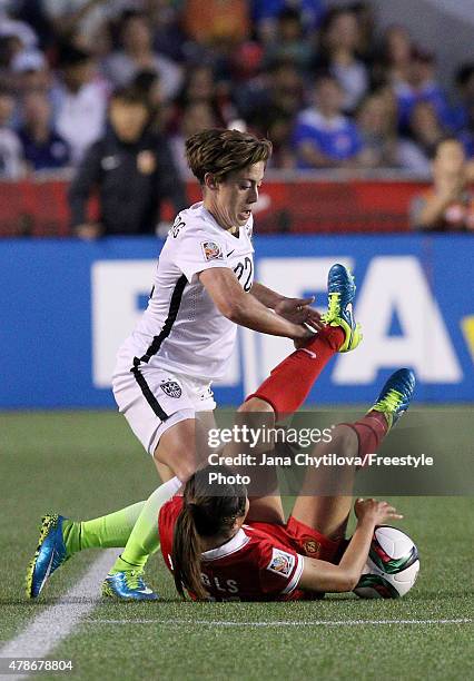 Meghan Klingenberg of the United States challenges Wang Lisi of China in the second half in the FIFA Women's World Cup 2015 Quarter Final match at...