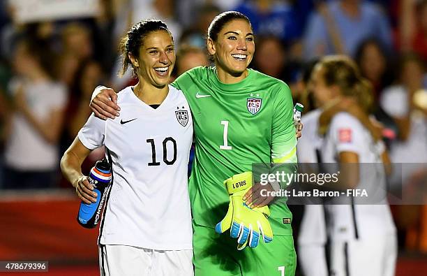 Carli Lloyd of USA celebrates with Hope Solo of USA after winning the FIFA Women's World Cup 2015 Quarter Final match between China and United States...