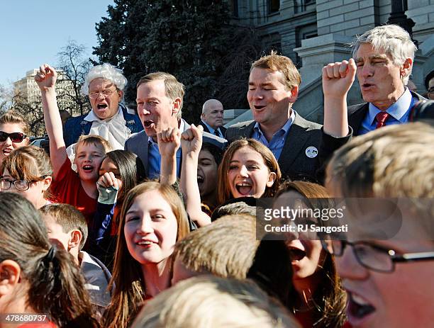 Colorado Governor John Hickenlooper and U.S. Senators Mark Udall and Michael Bennet take a photo with Colorado students, who are part of a group call...