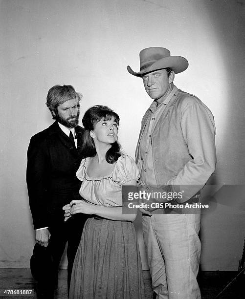 John Drew Barrymore as Anderson, Anne Helm as Helena Dales and James Arness as Matt Dillon on the GUNSMOKE episode, "Killer on Ice." Image dated...