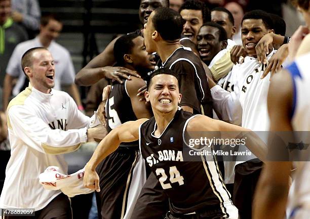 Matthew Wright of the St. Bonaventure Bonnies celebrates after a game winning basket by Jordan Gathers against the Saint Louis Billikens during the...