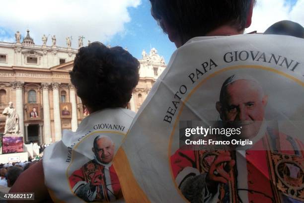 Faithful attend the Beatification ceremony of Popes Pius IX and John XXIII celebrated by Pope John Paul II in St. Peter's Square on September 3, 2000...