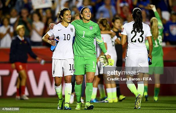 Carli Lloyd of USA celebrates with Hope Solo of USA after winning the FIFA Women's World Cup 2015 Quarter Final match between China and United States...