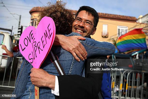 Same-sex marriage supporter Stuart Gaffney hugs a friend while celebrating the U.S Supreme Court ruling regarding same-sex marriage on June 26, 2015...