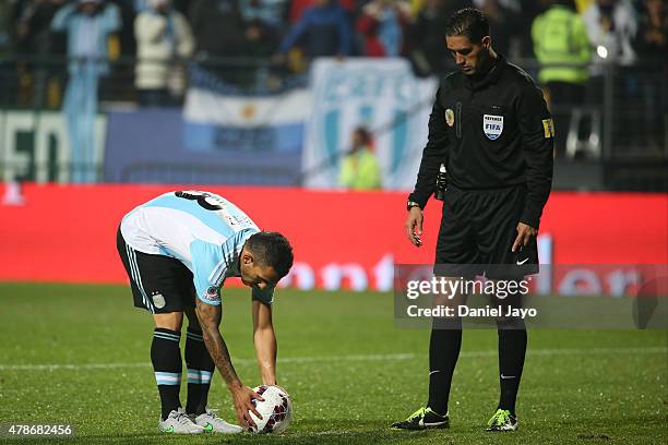 Carlos Tevez of Argentina prepares to kick the seventh penalty kick in the penalty shootout during the 2015 Copa America Chile quarter final match...