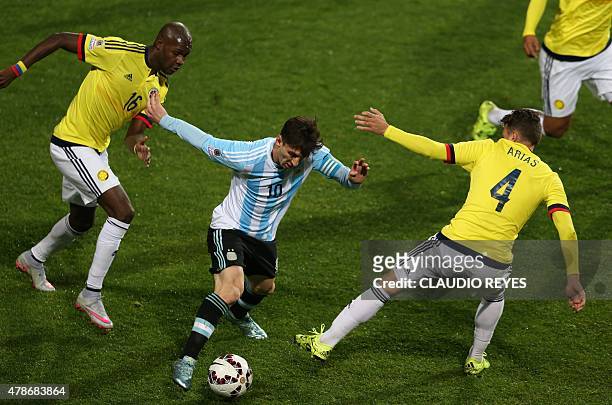 Argentina's forward Lionel Messi is marked by Colombia's forward Victor Ibarbo and defender Santiago Arias during the 2015 Copa America football...