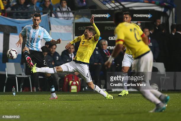Javier Pastore of Argentina fights for the ball with Santiago Arias of Colombia during the 2015 Copa America Chile quarter final match between...